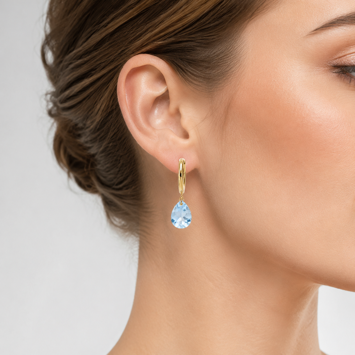 Aros cristal celeste Ovalado oro