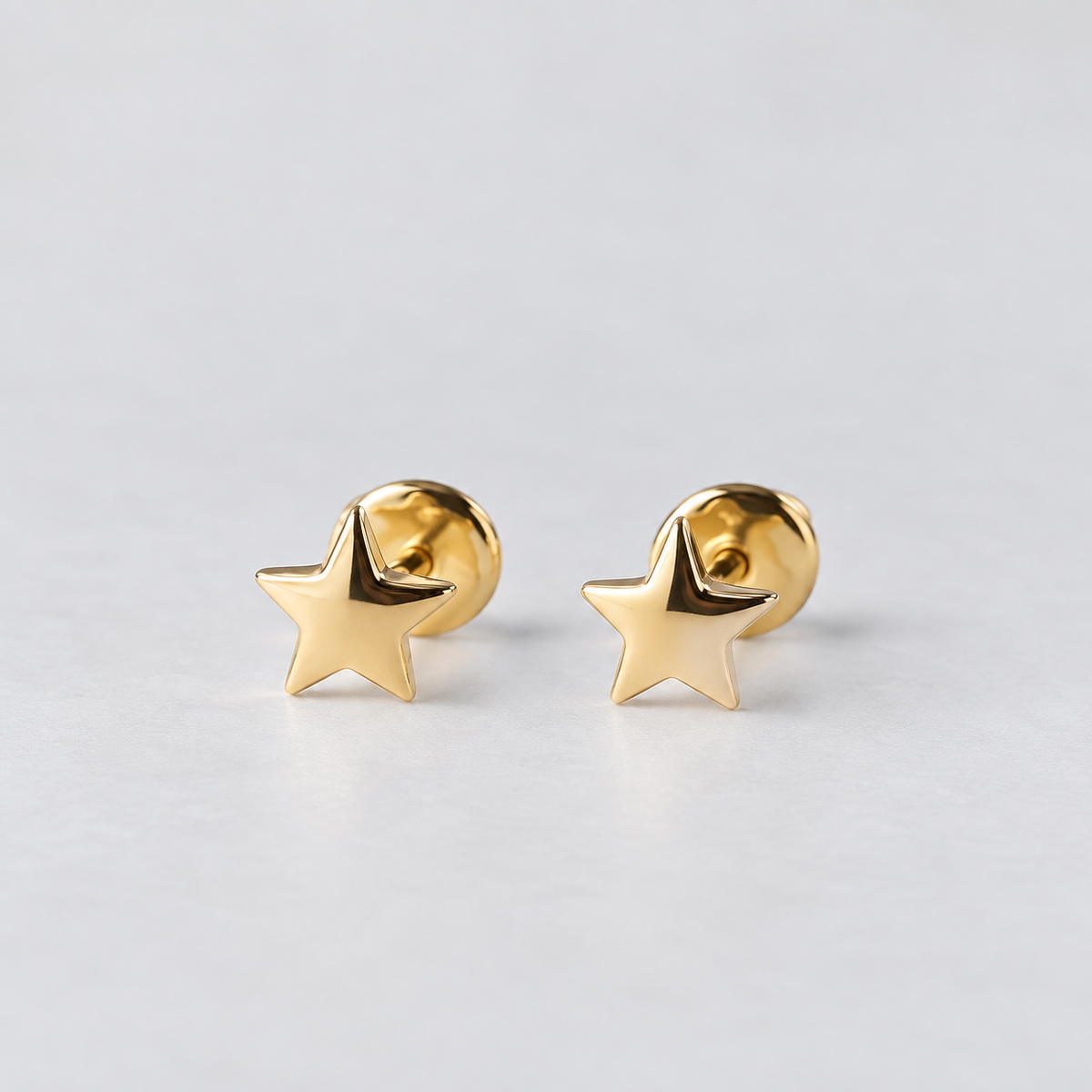 Aros mini estrella oro