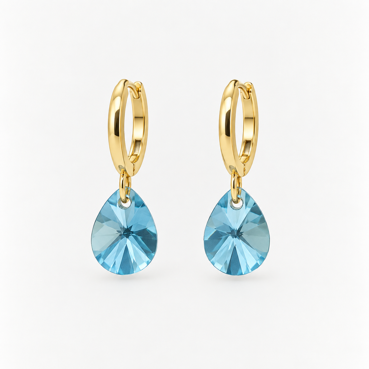 Aros cristal celeste Ovalado oro