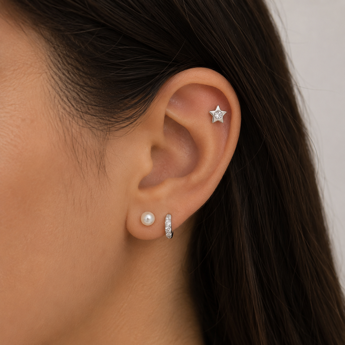 Aros piercing estrella luz circón plata
