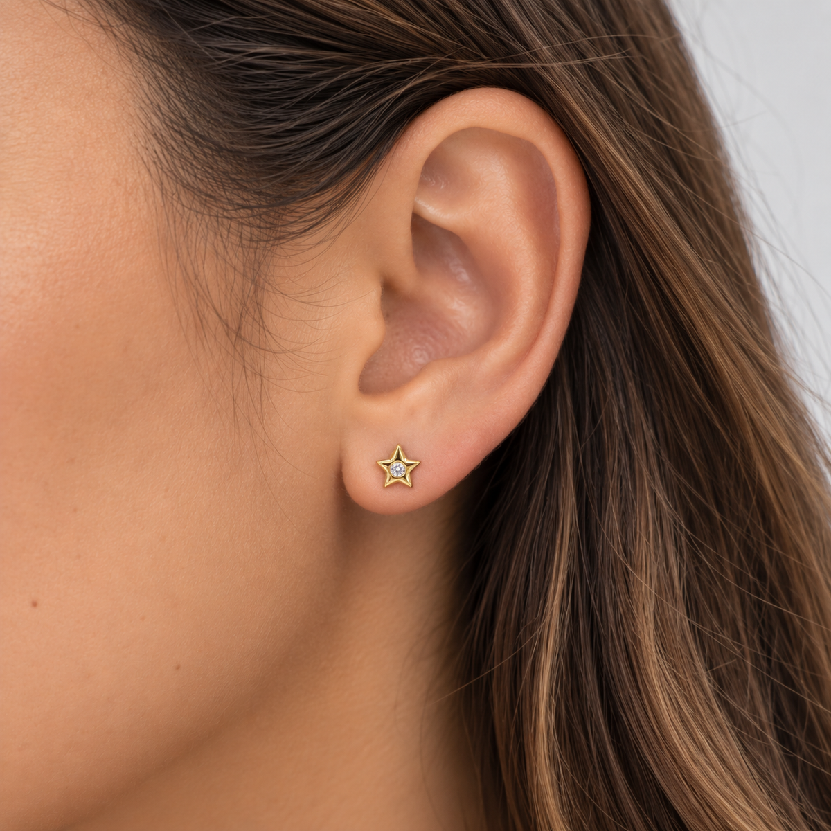 Aros estrella con circón oro
